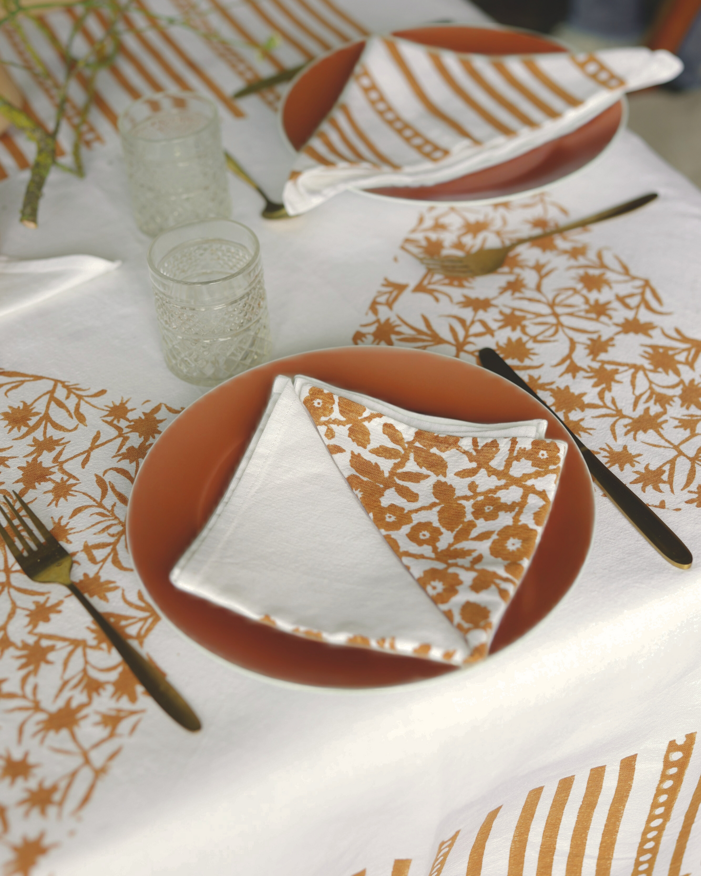 Close-up of artisanal rust print design made with hand-carved wooden stamps.
