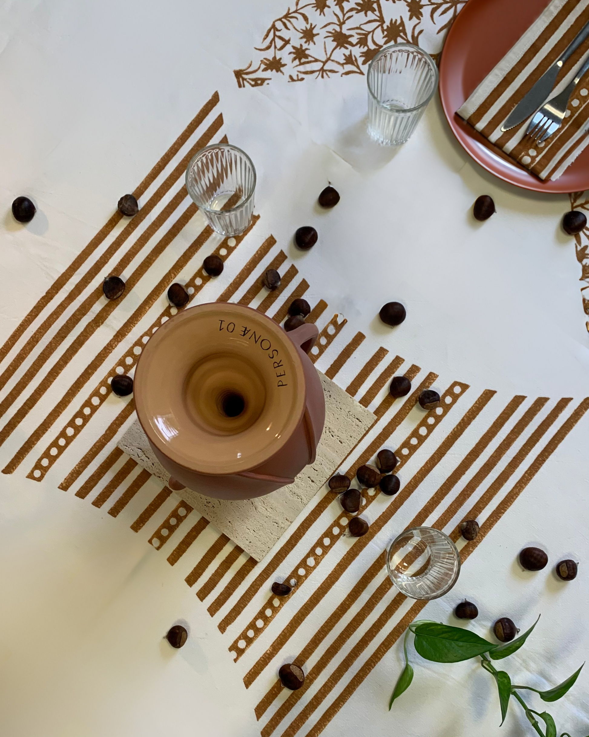 Handcrafted fabric decorated with traditional rust dye printing process.