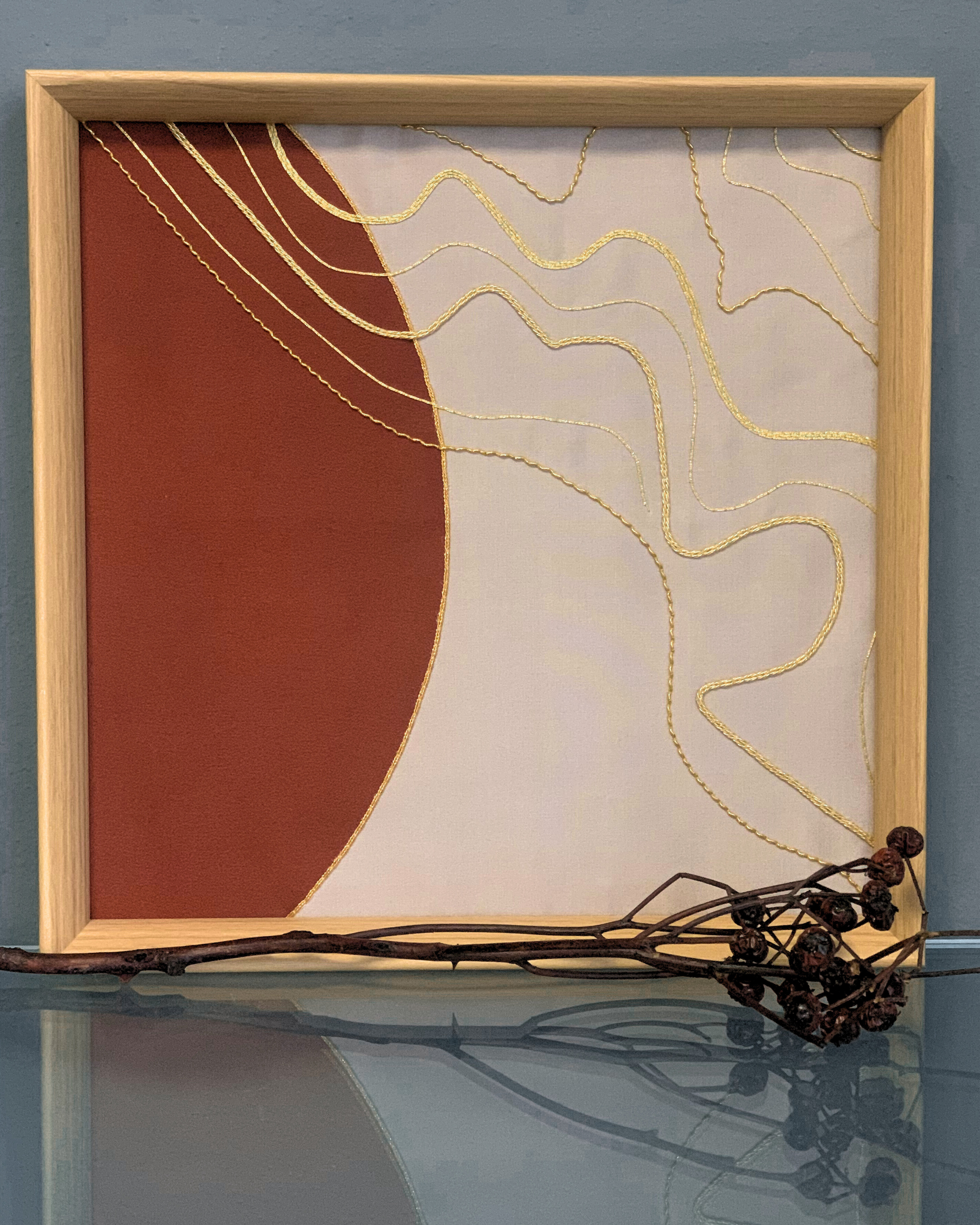 Close-up of intricate gold embroidery artwork handcrafted by a skilled artisan.